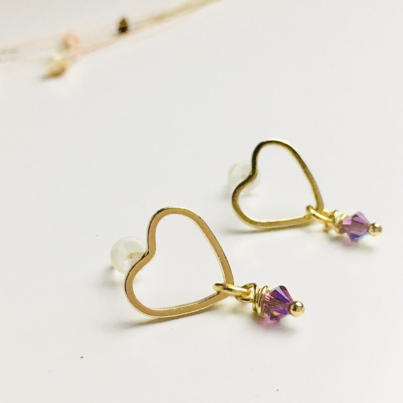 Vergulde hartjes oorbellen met Swarovski