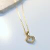 verguld zilveren ketting met gouden hartje met zirconia